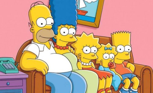 The Simpson family sitting on the couch.