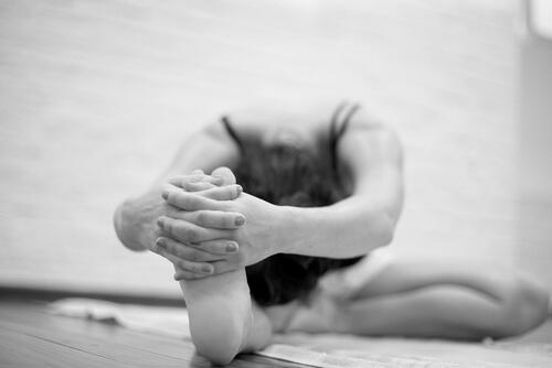 A woman doing Bikram Yoga.