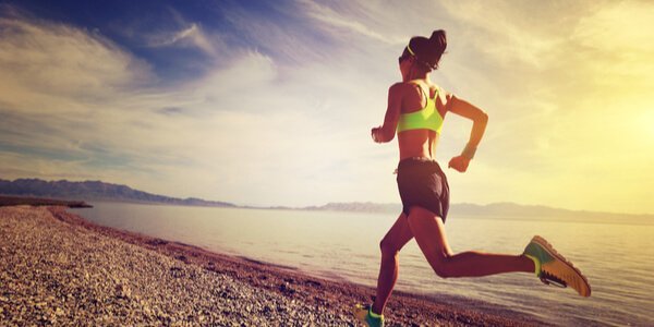 A woman running on the beach.