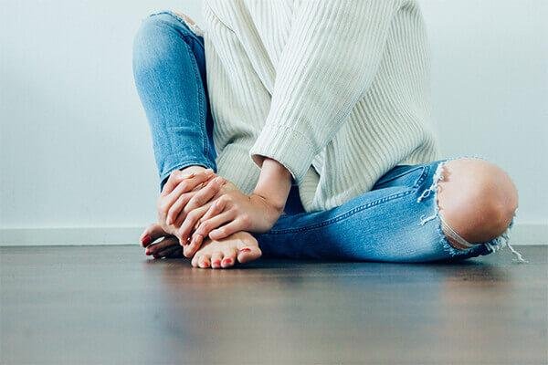 A woman sitting on the floor.