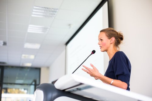 Woman speaking in public.