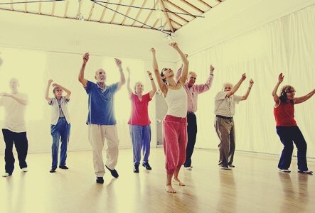 A group of older people in a dance class.