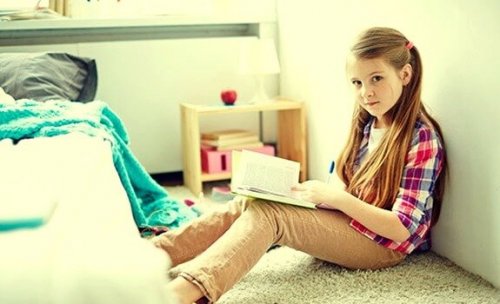 A girl reading in her room.