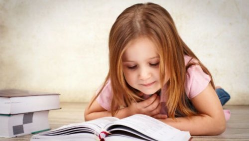 A little girl reading an inspiring story.
