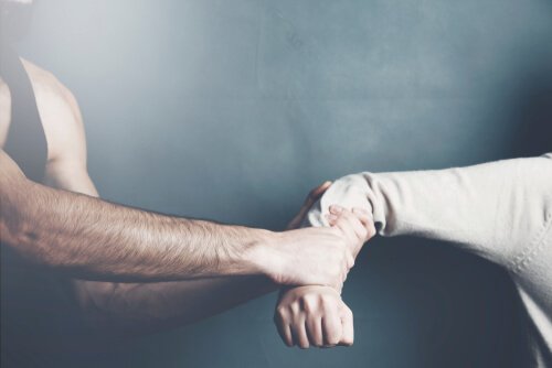 Man showing violent behavior towards a woman.