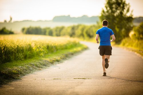 A man running who knows that ten minutes of exercise will make him happier.