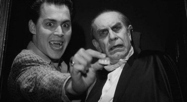 Johnny Depp holding a pair of false teeth in his hand in the Ed Wood movie.
