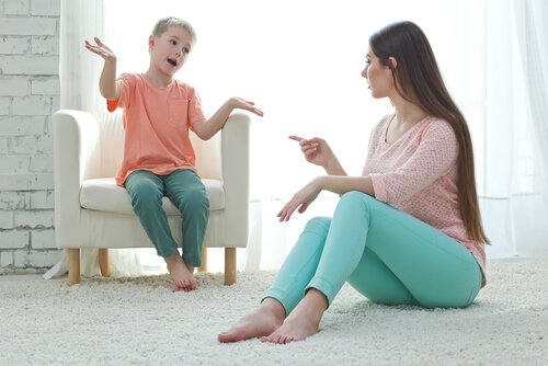 A mother talking to her son.
