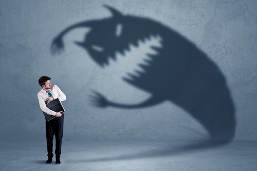 A shadow monster scaring a businessman.