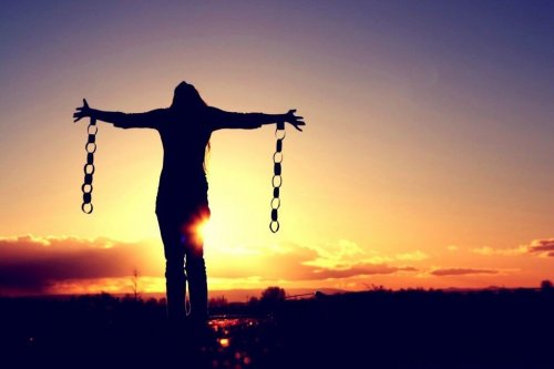 A woman freeing herself from her chains.