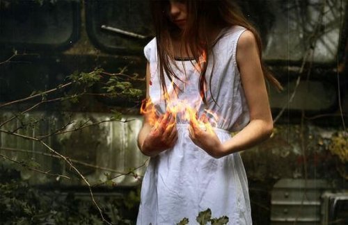 A woman holding fire.
