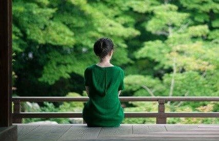 A woman in a green dress.