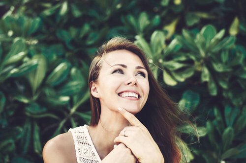 A woman smiling.