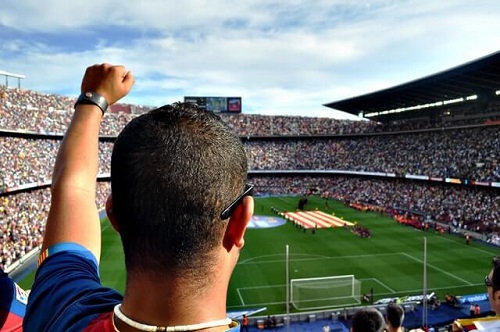 Soccer fans cheering.