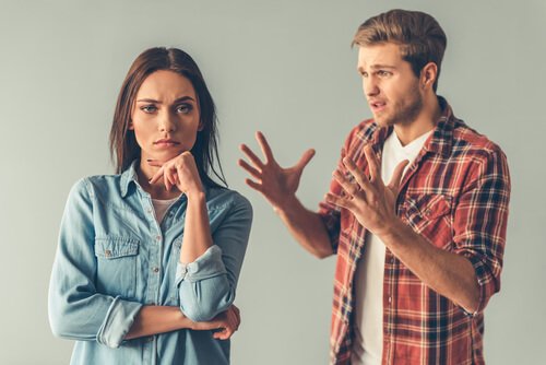 A guy mansplaining something to a woman.