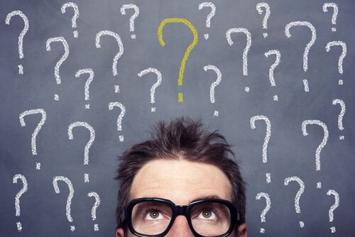 A guy with question marks above his head.