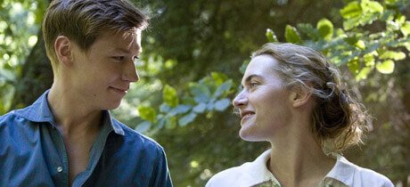 Michael and Hanna smiling while looking at each other.