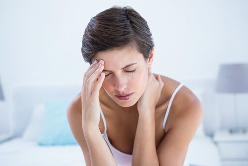 A woman with a migraine.