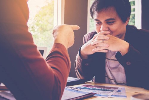 Putting the blame on someone.