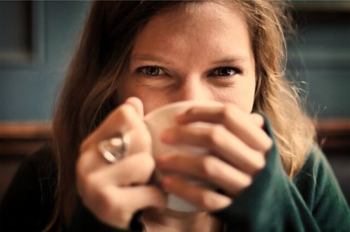 A woman drinking some tea.