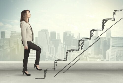 A businesswoman going up the stairs.