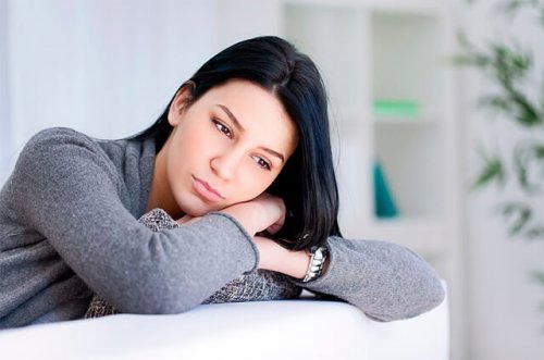 A woman sitting on a couch.