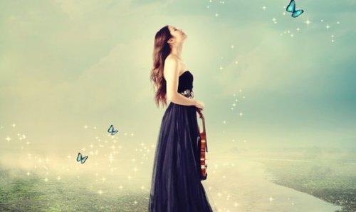 A young woman with a violin on her path to self-actualization.