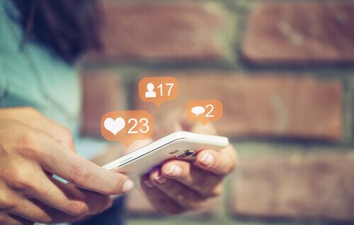 A woman looking at her notifications.