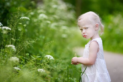 a little girl feeling disgruntled