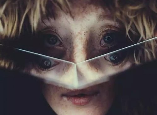 A body looking into a broken mirror.