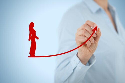 Someone drawing a woman walking on a curve.