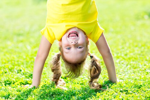 A girl doing a headstand.