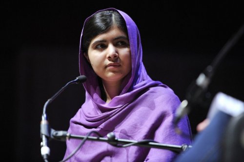 Malala with a microphone.