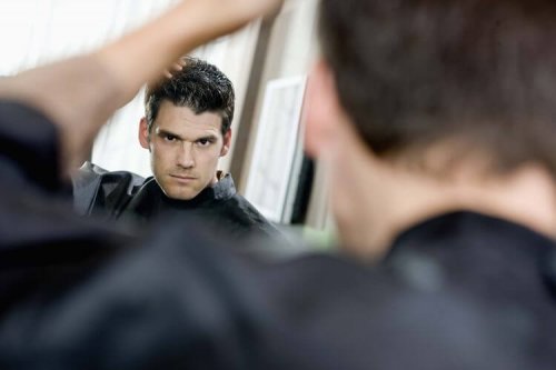 A narcissist looking at himself in the mirror.