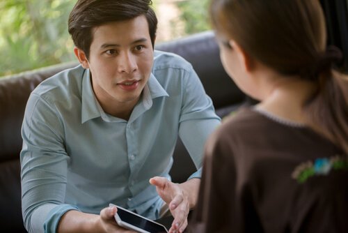 A man and a woman having a conversation.