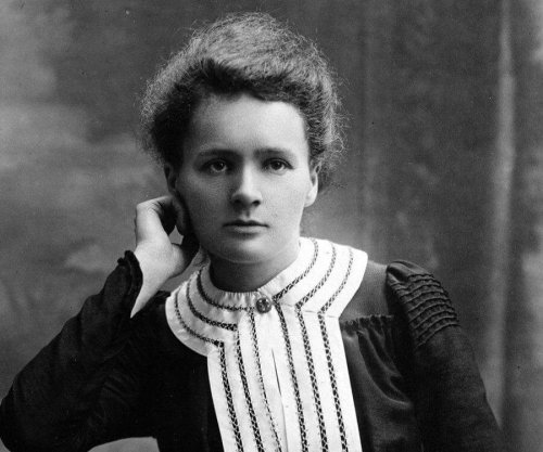 A young Marie Curie posing.