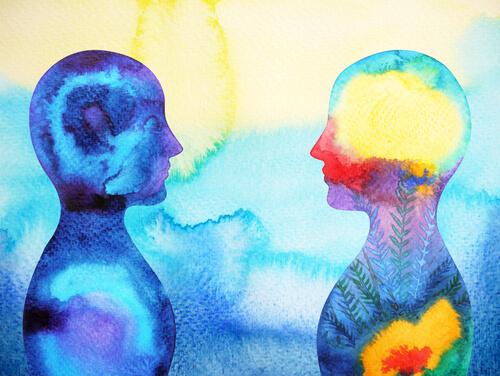 An illustration of the outline of two people painted in tie-dye colors showing them looking at each other face to face.