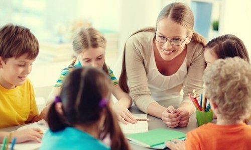 A smiling teacher with her students.