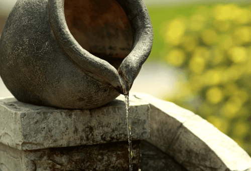 Water falling from clay pot.