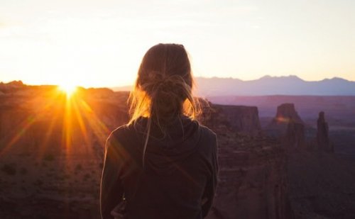 A woman looking at a landscape.