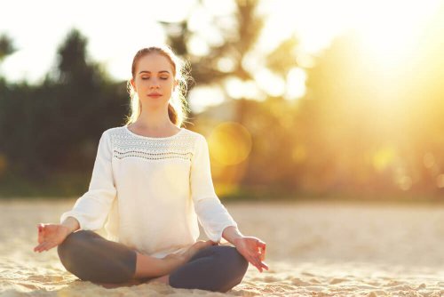 Woman meditating to reduce daily worries.