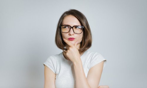 A woman thinking representing magical thinking.