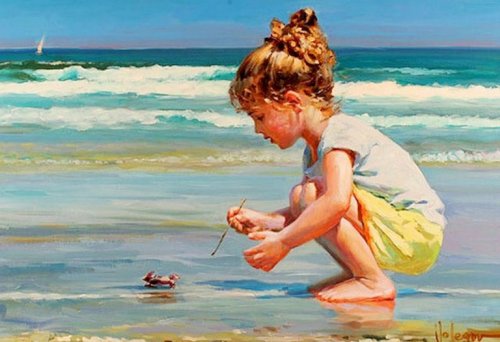 A little girl playing with a crab at the beach.