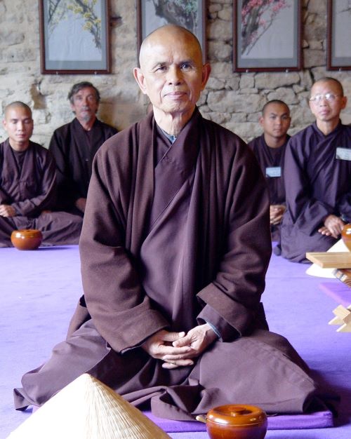 Thich Nhat Hanh sitting in class.