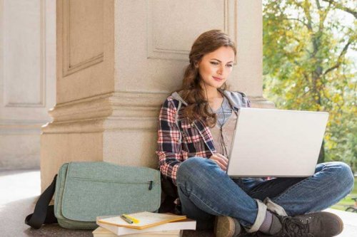 A woman studying with her laptop.