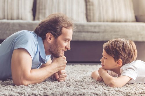A father and his son looking at each other.
