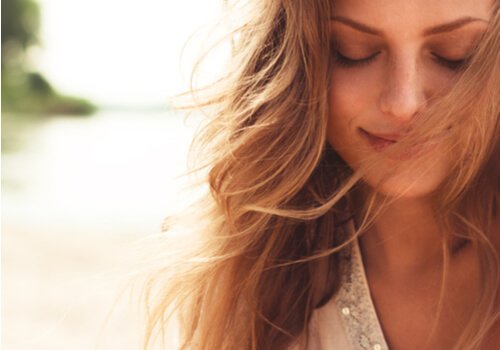 A happy woman with her eyes closed.