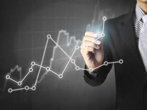 a man drawing a graph