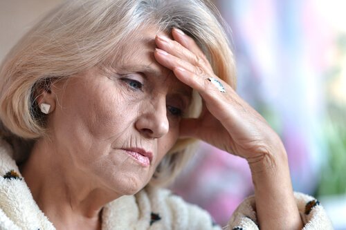 An older woman looking sad.
