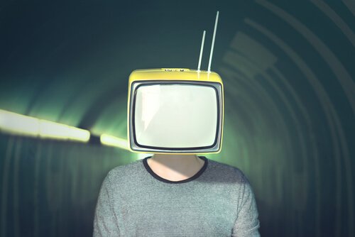 A picture showing a person with a TV for a head, standing in a tunnel.